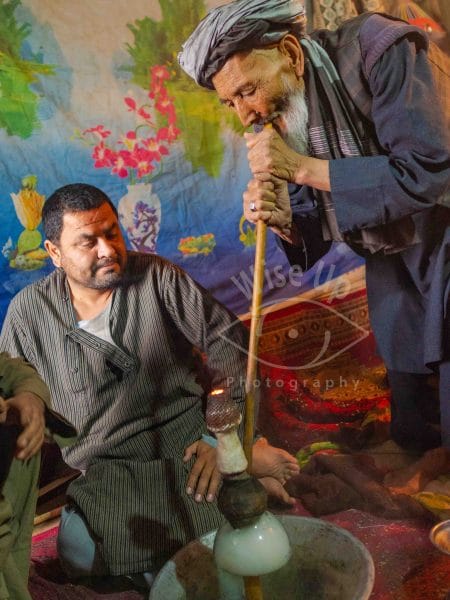 Former Afghan Mujahideen smoking a chillum
