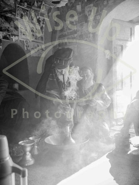 Afghan elder smoking a chillum