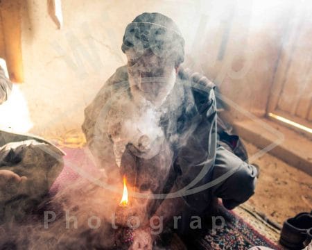 Cannabis farmer smoking on his chillum,Tashkurghan, Afghanistan.