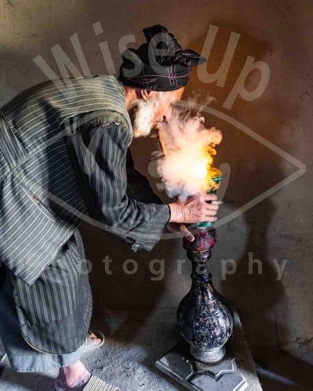 Afghan hash-maker smoking on his chillum